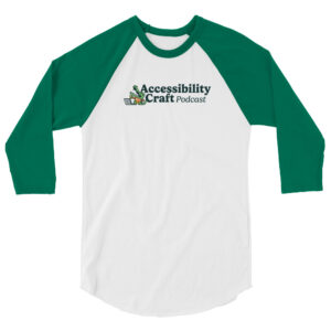 A white shirt with green three quarter length sleeves with the Accessibility Craft podcast logo, which includes an alligator wearing a t-shirt with "a11y" on it with a laptop and beer glass.