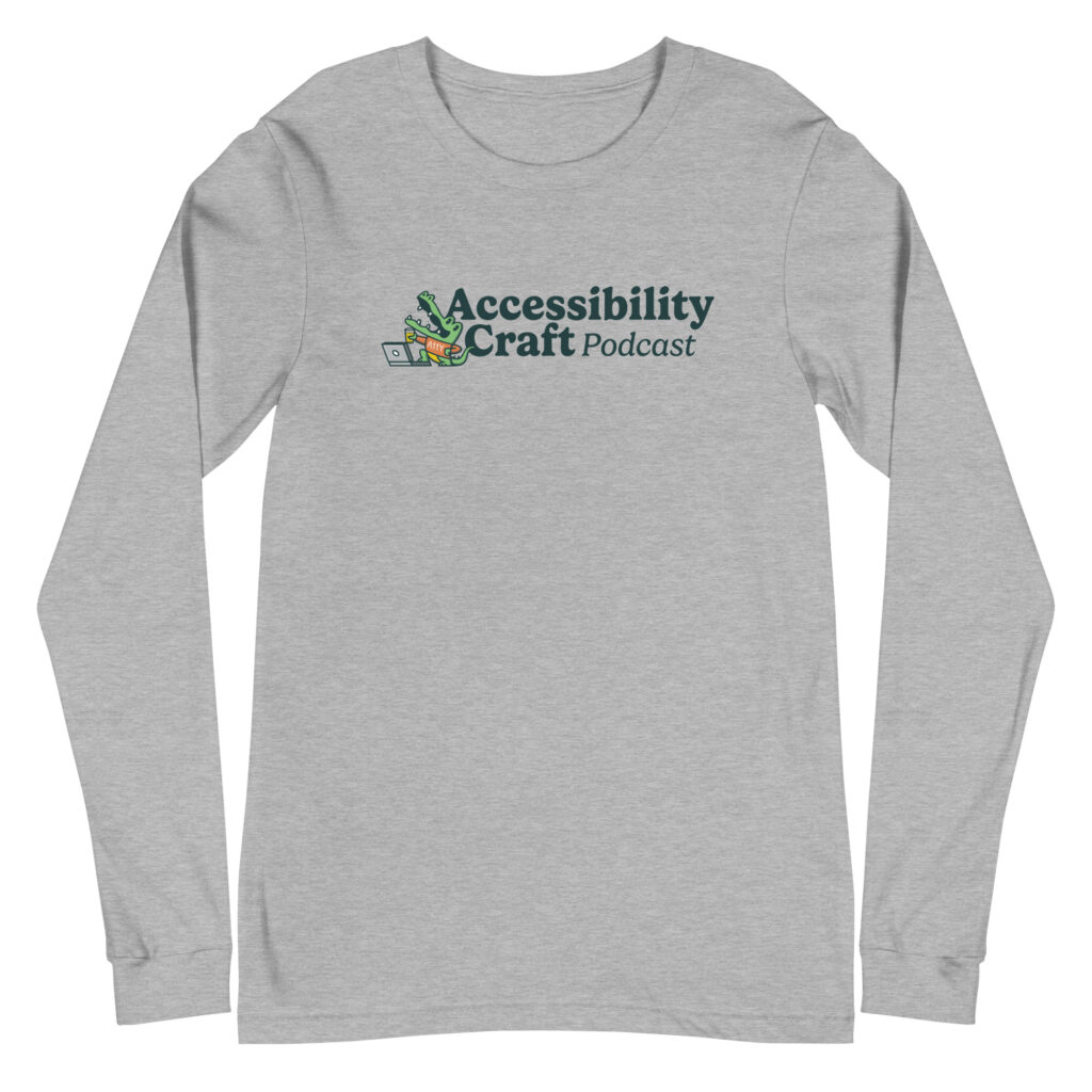 Light gray long-sleeve t-shirt with the Accessibility Craft podcast logo, which includes an alligator wearing a t-shirt with "a11y" on it with a laptop and beer glass.
