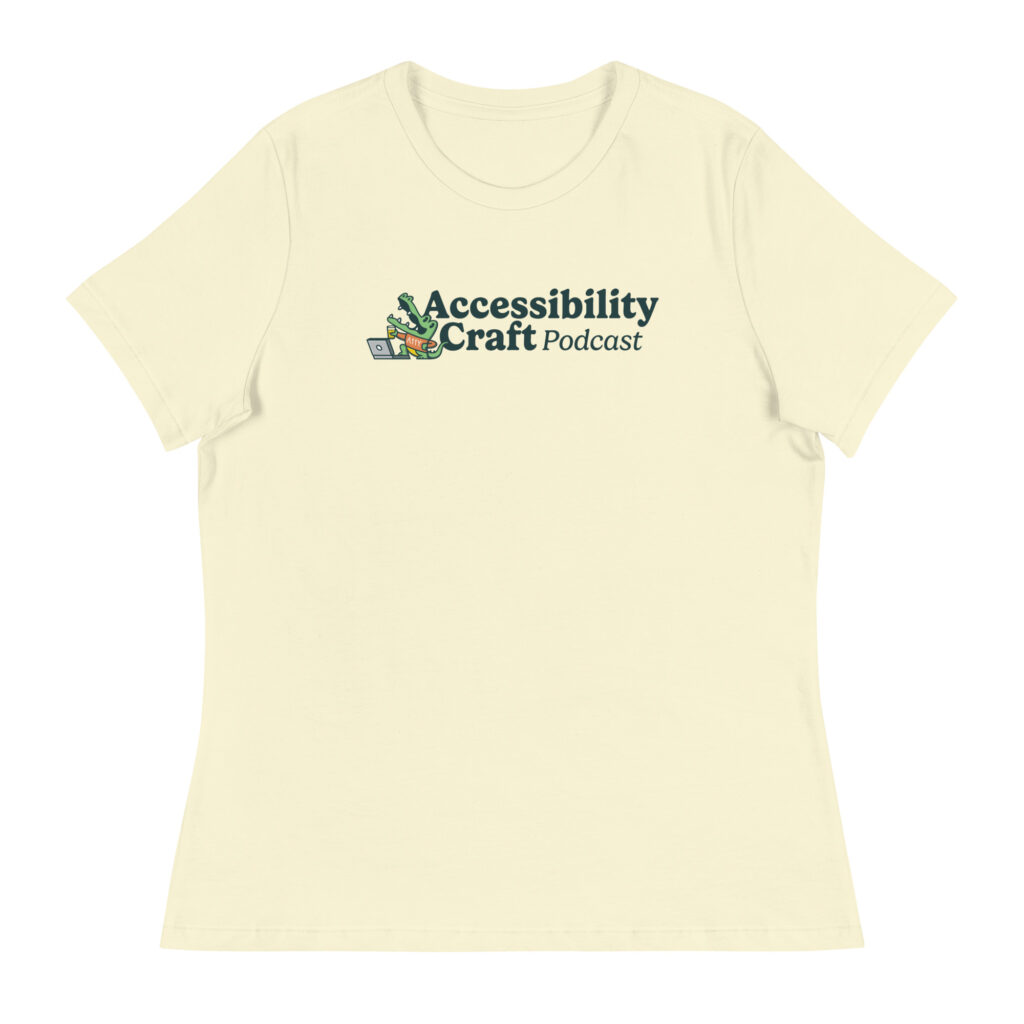 A light yellow t-shirt with the Accessibility Craft podcast logo, which includes an alligator wearing a t-shirt with "a11y" on it with a laptop and beer glass.