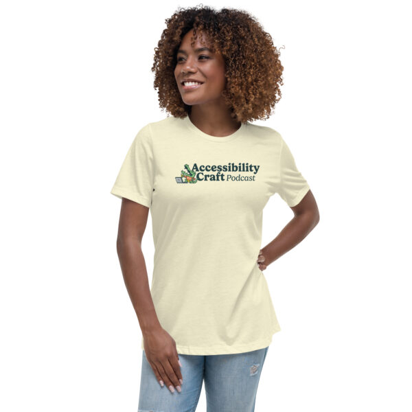 Slim black woman wearing an Accessibility Craft Podcast t-shirt.